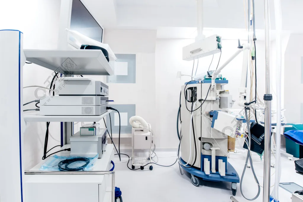 An aesthetic treatment room with instrument trolleys and screens.