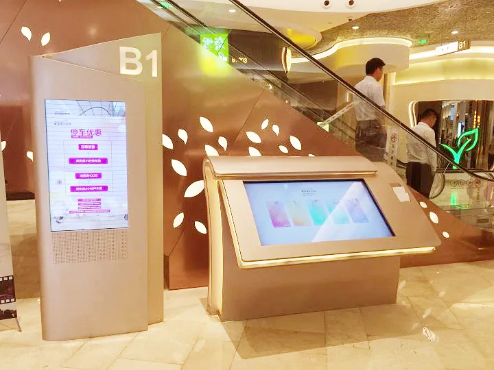 A pair of touch directory kiosks in a shopping mall atrium.